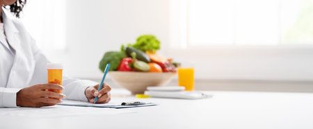 Cropped of black woman doctor dietologist prescribing pillsの写真素材