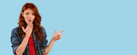 Shocked Girl Pointing Fingers Aside Covering Mouth On Yellow Backgroundの写真素材