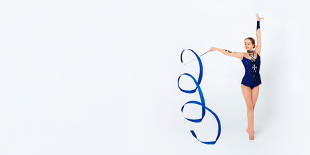 Professional gymnast in leotard with ribbon on white backgroundの写真素材