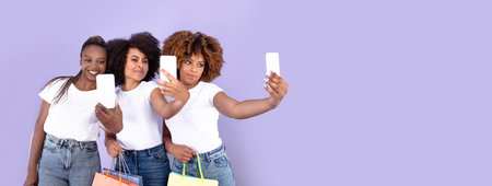 Black Women Shopping Making Selfie On Phones Over Purple Backgroundの写真素材