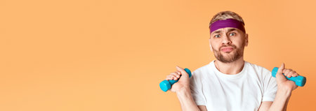 Bored millennial guy doing exercises, free spaceの写真素材