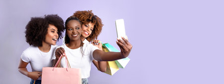 Three Black Ladies With Shopping Bags Taking Selfie, Purple Backgroundの写真素材