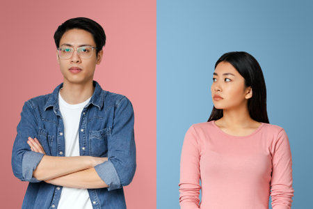 Sad asian girl looking at her angry boyfriendの写真素材