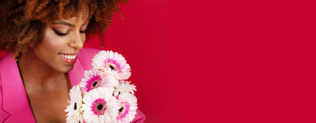 Portrait Of Black Lady Posing With Flowers Over Red Backgroundの写真素材