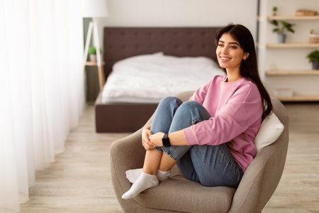 Smiling woman having rest at home on the weekendの写真素材