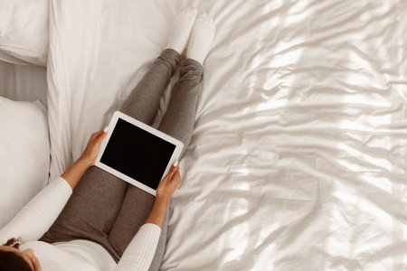 African American female holding tablet with blank screenの写真素材