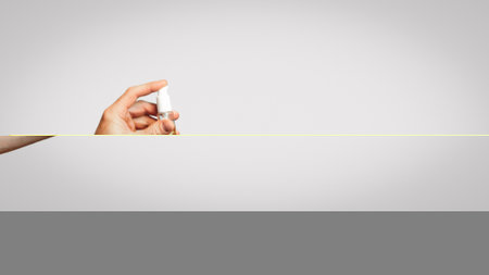 Man In Mask Holding Sanitizer Bottle Over Gray Background, Panoramaの写真素材