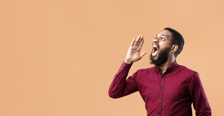 Black guy holding palm near mouth, screaming aside at copyspace