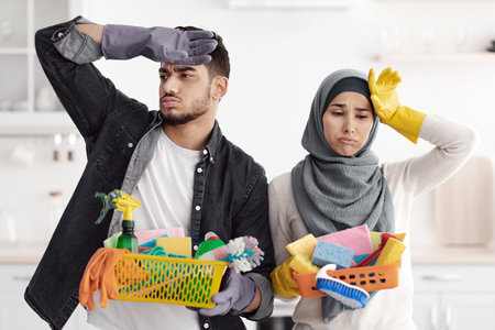 Tired muslim family after cleaning their new apartmentの写真素材
