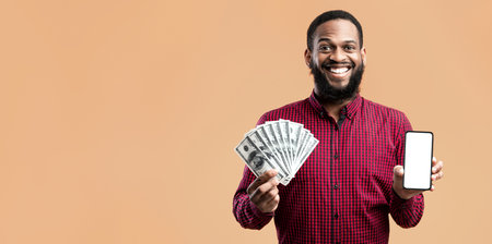 Afro guy holding mobile phone and bunch of money cash
