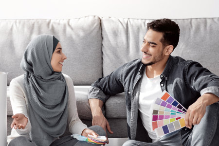 Creative arab family working on interior for their new houseの写真素材