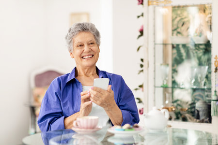 Senior woman enjoying coffee and conversation at a cozy cafe
