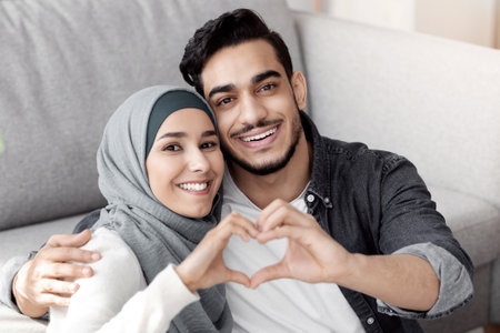Closeup of muslim family showing heart symbolの写真素材