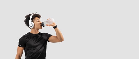 Young Brazilian man stays fit, hydrated, and listens to music