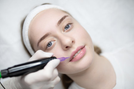 Client gets permanent makeup for long-lasting beauty resultsの写真素材