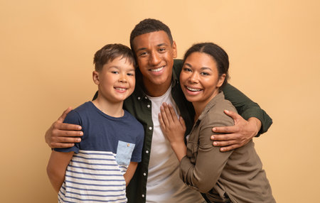 Family of three sharing love and joy in a warm, light-toned setting
