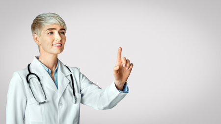 Doctor hand touching empty virtual screen. Friendly woman and modern technologyの写真素材
