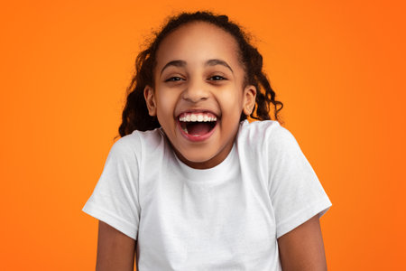 Positive African American Girl Laughing At Camera