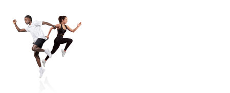 Couple running together in a fitness workout at a bright indoor spaceの写真素材