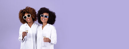 Two Black Women Holding Glasses Of Sparkling Wine, Purple Background