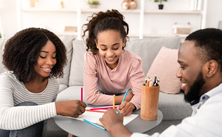 Portrait of a happy black family spending time at homeの写真素材