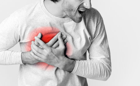 Man has hurt in chest, highlighted in redの写真素材