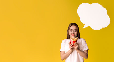 Young Woman Holding French Fries And Dreaming About Something