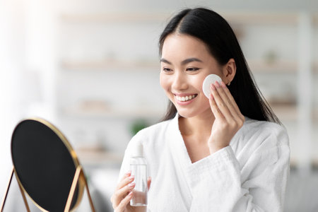 Person cleaning face with tonerの写真素材