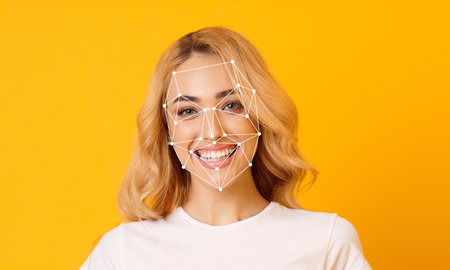 Facial recognition on a smiling person with a bright backgroundの写真素材