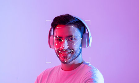 Facial recognition technology capturing a smiling individual with headphonesの写真素材
