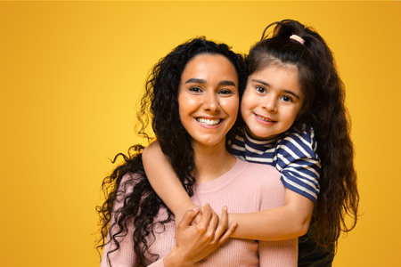 Love My Mommy. Cute Little Arab Girl Embracing Her Happy Momの写真素材
