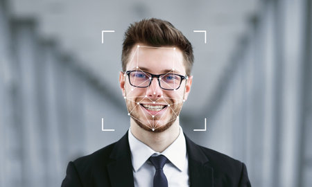 Facial recognition technology in action with a smiling man in formal attire