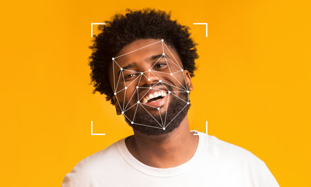 Facial recognition technology applied to cheerful man with curly hairの写真素材