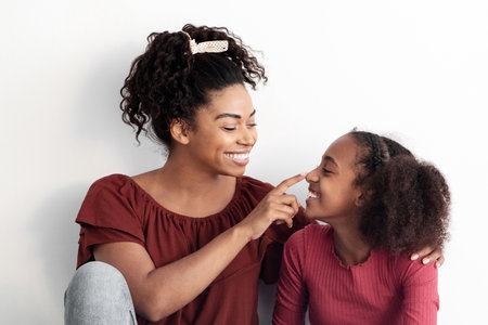 Loving african american mother spending time with her daughterの写真素材