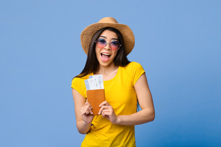 Finally Travelling. Excited Asian Tourist Girl Posing With Passport And Ticketsの写真素材