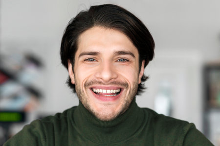 Portrait of cheerful attractive man in good mood having restの写真素材