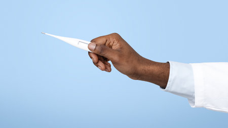 African american doctor hand holding temperature thermometer