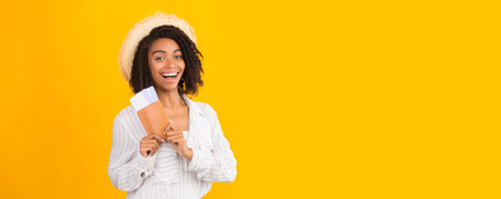 African American woman ready for trip holding passport and ticketsの写真素材