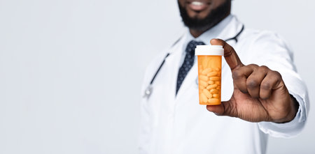 African american male doctor recommending pills, croppedの写真素材