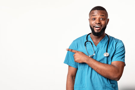 Surprised African American therapist pointing at empty spaceの写真素材