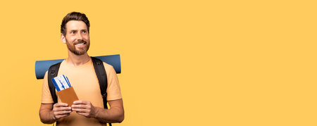 Excited millennial traveler ready for adventure with travel documents in handの写真素材