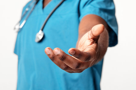 Healthcare professional reaching out for patient support and careの写真素材