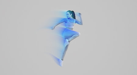 Woman in Blue Outfit Jumping in Airの写真素材