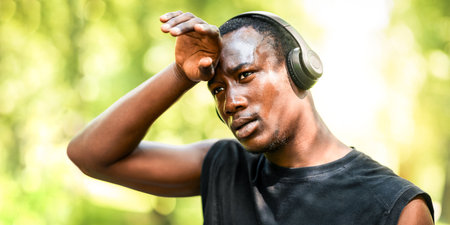 Exhausted man training at public parkの写真素材