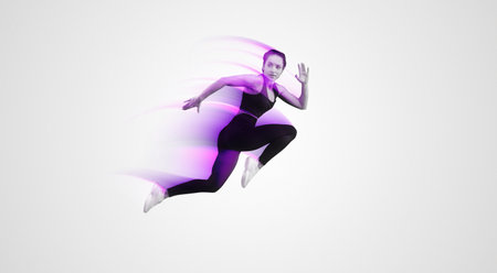 Woman in Black Top and Leggings Jumping in the Air