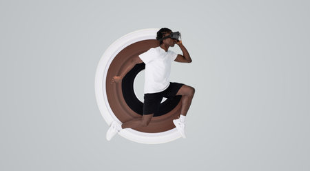 In motion shot of man wearing vr headset running in studio