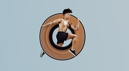 Athletic fit man sprinting and leaping forward on blue backgroundの写真素材