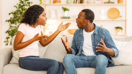 Young african man and woman arguing at homeの写真素材
