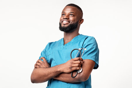 Skilled African American doctor smiling confidently in healthcare attireの写真素材