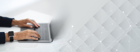 Closeup of unrecognizable businesswoman working on laptopの写真素材